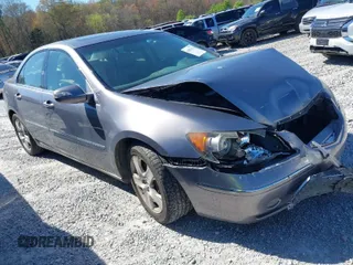 2007 Acura RL Tech Pkg with VIN JH4KB16647C002703, listed as a IAAI auction lot 41882614 with 174,713 mi miles. Bid and sale history available at carsss.com. Image 1.