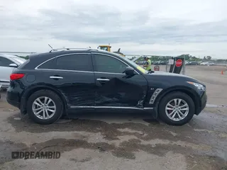 2014 Infiniti QX70 z VIN JN8CS1MU6EM450640, wystawiony jako IAAI lot #42335811 z przebiegiem 143 565 mil mil oraz . Historia ofert i sprzedaży dostępna na DreamBid. Obrazek 14.