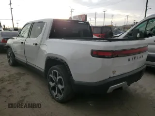 2022 Rivian R1T Adventure z VIN 7FCTGAAA9NN014280, wystawiony jako Copart lot #87908175 z przebiegiem 28 601 mil mil oraz Szkody całkowita. Historia ofert i sprzedaży dostępna na DreamBid. Obrazek 2.