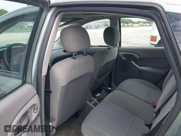 2004 Ford Focus with VIN 3FAFP37Z74R103228, listed as a IAAI auction lot 42658143 with 90,519 mi miles and . Bid and sale history available at DreamBid. Image 8.