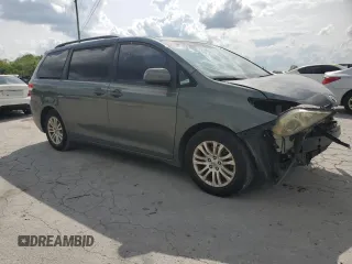 2014 Toyota Sienna XLE with VIN 5TDYK3DC2ES439353, listed as a Copart auction lot 54332275 with 130,312 mi miles and Salvage Title. Bid and sale history available at DreamBid. Image 4.