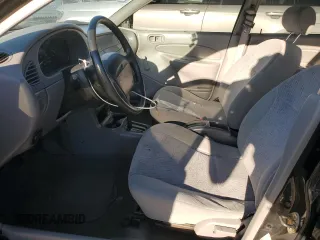 1999 Ford Escort LX with VIN 1FAFP10P5XW277376, listed as a Copart auction lot 82148204 with 127,634 mi miles and Salvage Title. Bid and sale history available at carsss.com. Image 7.