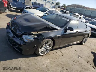2014 BMW 6 Series 650i xDrive with VIN WBA6B4C52ED099386, listed as a Copart auction lot 74040964 with 96,931 mi miles and Salvage Title. Bid and sale history available at carsss.com. Image 1.