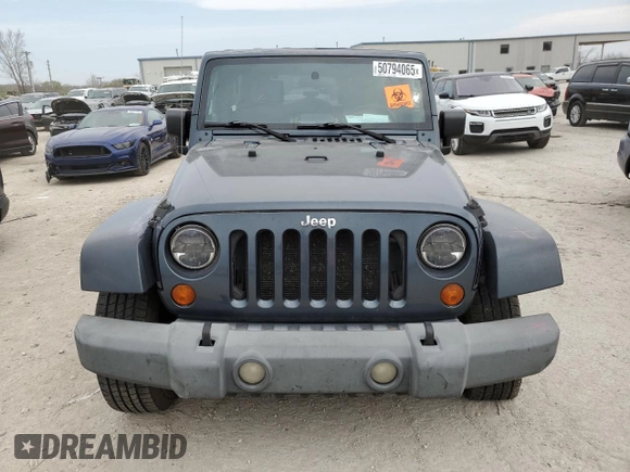 2007 Jeep Wrangler Unlimited Sahara z VIN 1J4GB59147L165439, wystawiony jako Copart lot #50794065 z przebiegiem 255 385 mil mil oraz Szkoda całkowita • Salvage title. Historia ofert i sprzedaży dostępna na DreamBid. Obrazek 5.