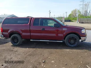 2005 Ford F-150 XLT with VIN 1FTPX12505FB69853, listed as a IAAI auction lot 42092756 with 330,699 mi miles. Bid and sale history available at carsss.com. Image 13.