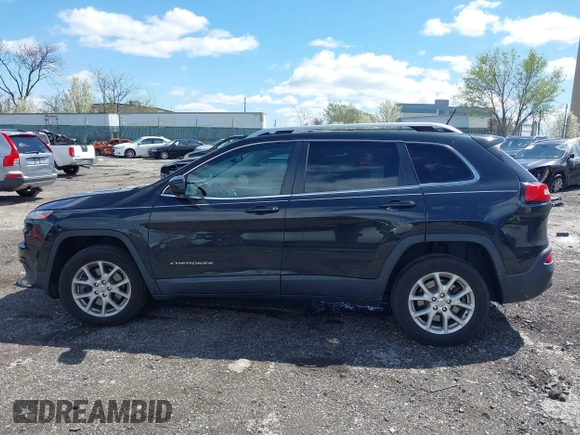 2014 Jeep Cherokee Latitude with VIN 1C4PJMCS8EW257959, listed as a IAAI auction lot 41987529 with 124,749 mi miles. Bid and sale history available at carsss.com. Image 15.