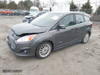 2015 Ford C-Max Energi SEL with VIN 1FADP5CU7FL121209, listed as a IAAI auction lot 41621034 with 145,648 mi miles. Bid and sale history available at carsss.com. Image 2.