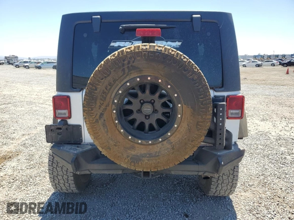 2016 Jeep Wrangler Unlimited Sport with VIN 1C4BJWDG0GL309976, listed as a Copart auction lot 63340505 with 66,714 mi miles and Salvage title. Bid and sale history available at DreamBid. Image 6.
