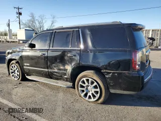 2018 GMC Yukon Denali with VIN 1GKS1CKJ0JR106589, listed as a Copart auction lot 79977034 with 98,022 mi miles and Salvage Title. Bid and sale history available at carsss.com. Image 2.