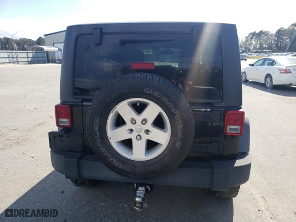 2013 Jeep Wrangler Unlimited Freedom Edition with VIN 1C4BJWDGXDL702914, listed as a Copart auction lot 49461175 with 191,610 mi miles and Clean Title. Bid and sale history available at carsss.com. Image 6.