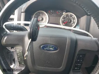 2011 Ford Escape XLT with VIN 1FMCU9DG9BKC38929, listed as a IAAI auction lot 41784854 with 216,201 mi miles. Bid and sale history available at carsss.com. Image 11.