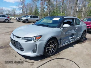 2014 Scion tC with VIN JTKJF5C70E3083839, listed as a IAAI auction lot 41886711 with 118,029 mi miles. Bid and sale history available at carsss.com. Image 6.