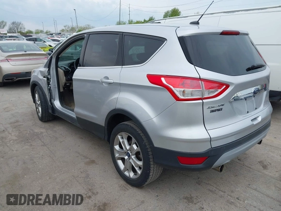 2013 Ford Escape SEL with VIN 1FMCU0HX1DUB81641, listed as a IAAI auction lot 42090788 with 111,496 mi miles and . Bid and sale history available at DreamBid. Image 3.