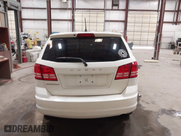 2015 Dodge Journey American Value z VIN 3C4PDCAB4FT714200, wystawiony jako IAAI lot #42199910 z przebiegiem 205 009 mil mil oraz . Historia ofert i sprzedaży dostępna na DreamBid. Obrazek 16.
