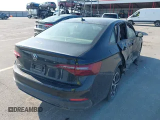 2023 Volkswagen Jetta Sport with VIN 3VWBM7BU2PM022530, listed as a IAAI auction lot 42215101 with 7,455 mi miles and . Bid and sale history available at DreamBid. Image 4.