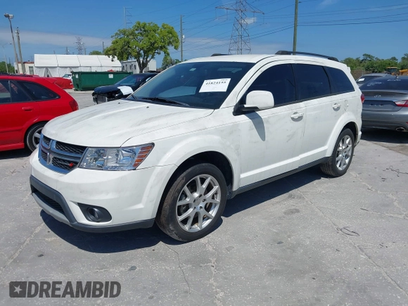 2014 Dodge Journey SXT with VIN 3C4PDCBG4ET235848, listed as a IAAI auction lot 41824155 with 48,691 mi miles and . Bid and sale history available at DreamBid. Image 2.