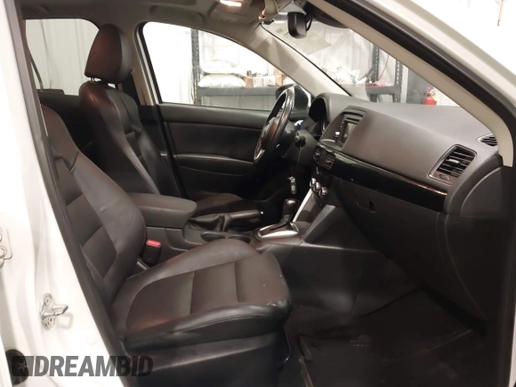 2015 Mazda CX-5 Grand Touring with VIN JM3KE4DY4F0495627, listed as a IAAI auction lot 41887773 with 130,421 mi miles. Bid and sale history available at carsss.com. Image 5.