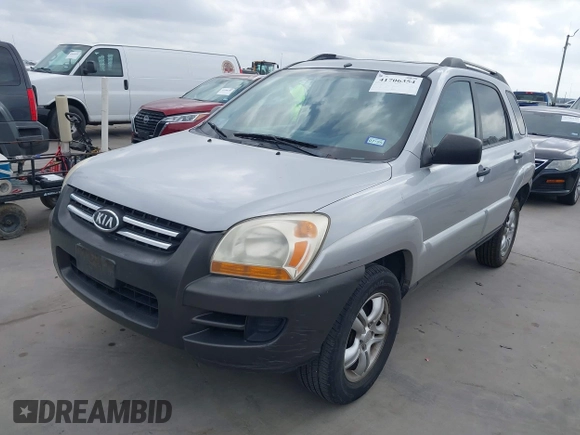 2005 Kia Sportage LX with VIN KNDJF723757087655, listed as a IAAI auction lot 41706354 with 164,736 mi miles and . Bid and sale history available at carsss.com. Image 2.