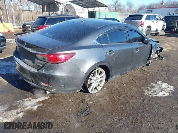 2014 Mazda 6 i Grand Touring with VIN JM1GJ1W67E1137886, listed as a IAAI auction lot 41405112 with 159,879 mi miles and . Bid and sale history available at DreamBid. Image 4.