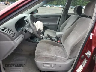 2004 Toyota Camry LE z VIN JTDBE32KX40273821, wystawiony jako Copart lot #58938275 z przebiegiem 153 096 mil mil oraz Szkoda całkowita • Salvage title. Historia ofert i sprzedaży dostępna na DreamBid. Obrazek 7.