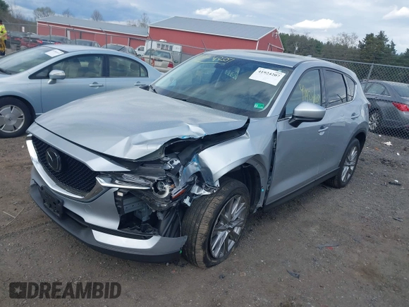 2021 Mazda CX-5 Grand Touring with VIN JM3KFBDM3M0354348, listed as a IAAI auction lot 41924207 with 45,786 mi miles. Bid and sale history available at carsss.com. Image 2.