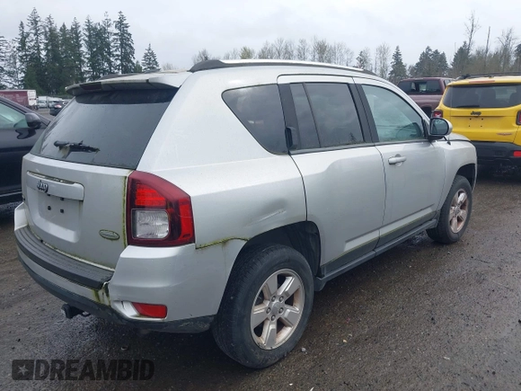 2014 Jeep Compass Latitude with VIN 1C4NJCEAXED522723, listed as a IAAI auction lot 41907230 with 98,252 mi miles and . Bid and sale history available at carsss.com. Image 4.
