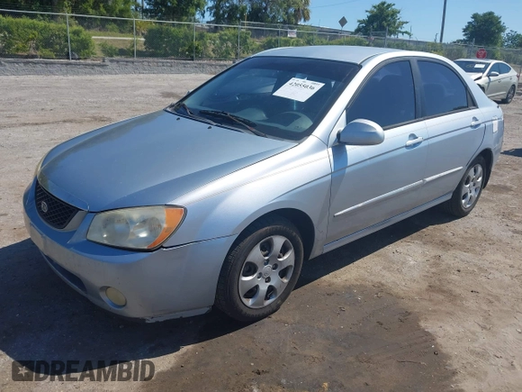 2005 Kia Spectra LX with VIN KNAFE121955107403, listed as a IAAI auction lot 42055036 with 157,605 mi miles. Bid and sale history available at carsss.com. Image 17.
