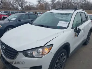 2016 Mazda CX-5 Grand Touring z VIN JM3KE2DY8G0885006, wystawiony jako IAAI lot #41615873 z przebiegiem 118 890 mil mil oraz . Historia ofert i sprzedaży dostępna na DreamBid. Obrazek 6.