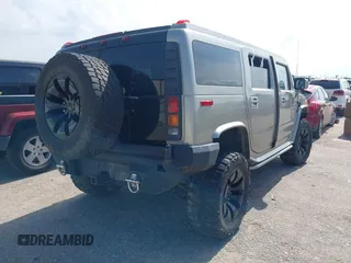 2004 Hummer H2 z VIN 5GRGN23U34H105809, wystawiony jako IAAI lot #42456055 z przebiegiem Nie podano mil oraz . Historia ofert i sprzedaży dostępna na DreamBid. Obrazek 4.