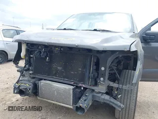 2021 Ford F-150 XL with VIN 1FTEW1CP1MKD21526, listed as a IAAI auction lot 42104907 with 76,317 mi miles and . Bid and sale history available at DreamBid. Image 6.