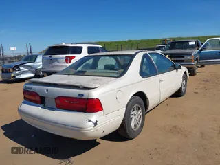 1996 Ford Thunderbird LX with VIN 1FALP62W3TH135238, listed as a IAAI auction lot 41692746 with 136,464 mi miles and . Bid and sale history available at DreamBid. Image 4.
