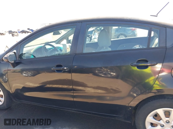 2014 Kia Rio LX with VIN KNADM4A39E6364490, listed as a IAAI auction lot 42128702 with 130,981 mi miles and . Bid and sale history available at DreamBid. Image 15.