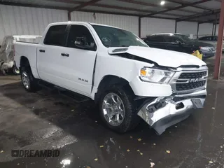 2023 Ram 1500 Big Horn z VIN 1C6RRFFG7PN698664, wystawiony jako IAAI lot #41103495 z przebiegiem 34 307 mil mil oraz . Historia ofert i sprzedaży dostępna na DreamBid. Obrazek 1.