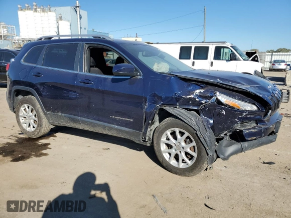 2015 Jeep Cherokee Latitude with VIN 1C4PJMCB9FW709077, listed as a Copart auction lot 76240454 with 104,882 mi miles and Salvage Title. Bid and sale history available at DreamBid. Image 4.