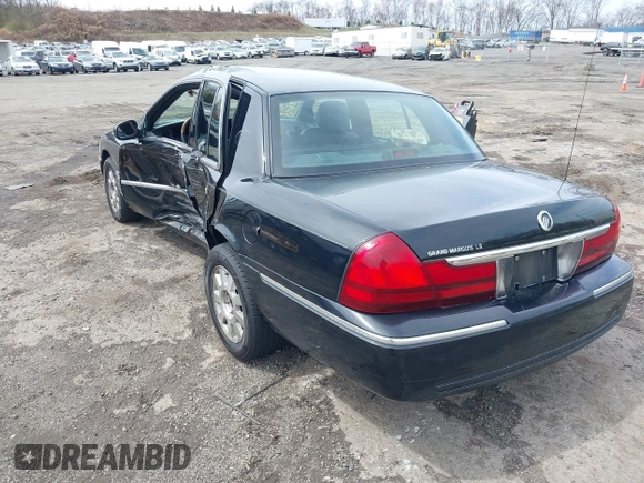 2005 Mercury Grand Marquis LS Premium z VIN 2MEFM75W65X671622, wystawiony jako IAAI lot #41958287 z przebiegiem 154 662 mil mil oraz . Historia ofert i sprzedaży dostępna na DreamBid. Obrazek 3.