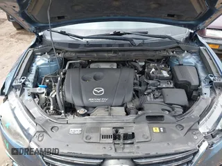 2016 Mazda CX-5 Touring z VIN JM3KE2CY3G0728968, wystawiony jako IAAI lot #42189174 z przebiegiem 145 977 mil mil oraz . Historia ofert i sprzedaży dostępna na DreamBid. Obrazek 10.