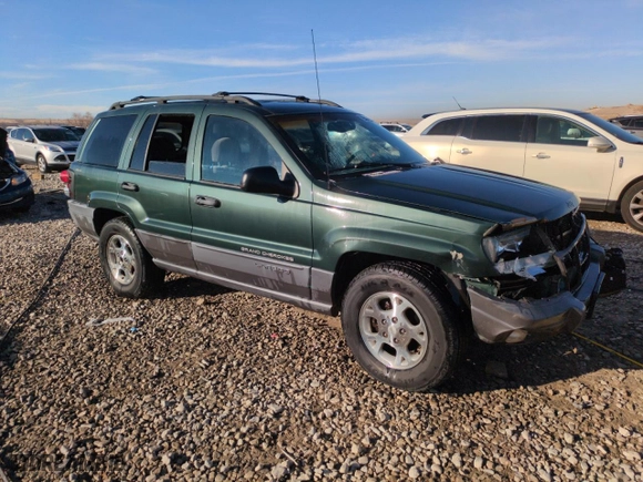2001 Jeep Grand Cherokee Laredo with VIN 1J4GW48N21C570404, listed as a Copart auction lot 85996954 with 153,838 mi miles and Salvage Title. Bid and sale history available at carsss.com. Image 4.