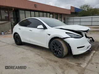 2023 Tesla Model Y Long Range z VIN 7SAYGAEE9PF686434, wystawiony jako Copart lot #54593475 z przebiegiem Nie podano mil oraz Szkoda całkowita • Salvage title. Historia ofert i sprzedaży dostępna na DreamBid. Obrazek 4.