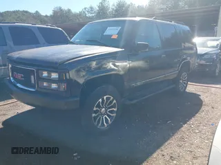 1999 GMC Yukon with VIN 1GKEK13R4XJ762708, listed as a IAAI auction lot 41653291 with 200,240 mi miles. Bid and sale history available at carsss.com. Image 2.