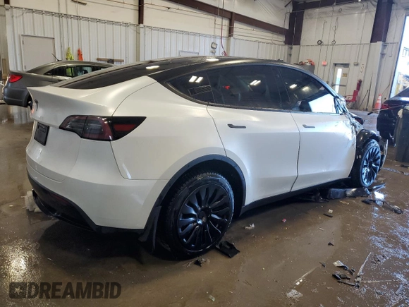 2023 Tesla Model Y Long Range z VIN 7SAYGAEE5PF672546, wystawiony jako Copart lot #42779065 z przebiegiem 27 570 mil mil oraz Nie do naprawy • Non repairable. Historia ofert i sprzedaży dostępna na DreamBid. Obrazek 3.