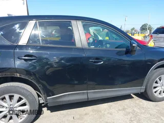 2016 Mazda CX-5 Touring z VIN JM3KE4CY2G0656270, wystawiony jako IAAI lot #42344489 z przebiegiem 60 449 mil mil oraz . Historia ofert i sprzedaży dostępna na DreamBid. Obrazek 14.
