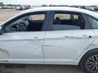2021 Volkswagen Jetta S z VIN 3VWC57BU0MM021874, wystawiony jako IAAI lot #42124747 z przebiegiem 89 887 mil mil oraz . Historia ofert i sprzedaży dostępna na DreamBid. Obrazek 14.
