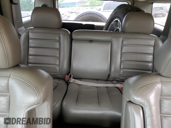 2003 Hummer H2 z VIN 5GRGN23U73H146894, wystawiony jako Copart lot #53449905 z przebiegiem 153 870 mil mil oraz Szkoda całkowita • Salvage title. Historia ofert i sprzedaży dostępna na DreamBid. Obrazek 10.