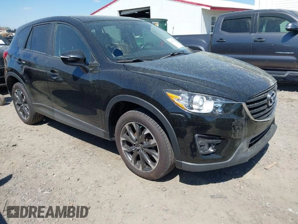 2016 Mazda CX-5 Grand Touring with VIN JM3KE4DY9G0893174, listed as a IAAI auction lot 41887814 with 79,811 mi miles. Bid and sale history available at carsss.com. Image 1.