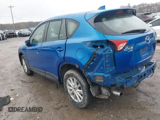 2014 Mazda CX-5 Sport with VIN JM3KE4BE6E0336504, listed as a IAAI auction lot 41961244 with 125,150 mi miles. Bid and sale history available at carsss.com. Image 3.