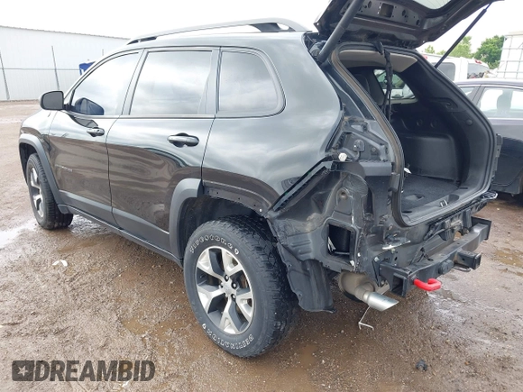 2015 Jeep Cherokee Trailhawk with VIN 1C4PJMBS5FW647601, listed as a IAAI auction lot 42437734 with 170,640 mi miles and . Bid and sale history available at DreamBid. Image 3.