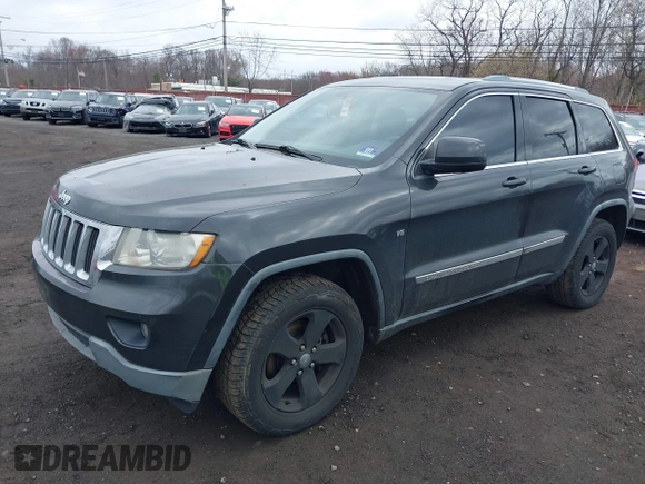 2011 Jeep Grand Cherokee Laredo with VIN 1J4RR4GGXBC597743, listed as a IAAI auction lot 41897286 with 253,111 mi miles and . Bid and sale history available at DreamBid. Image 2.