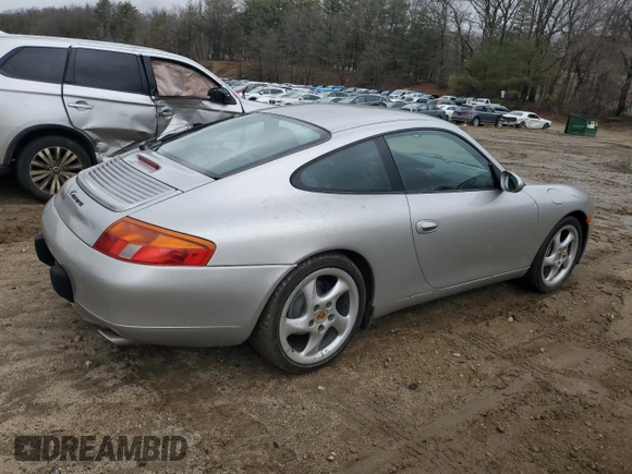 1999 Porsche 911 z VIN WP0AA2992XS621138, wystawiony jako Copart lot #49492405 z przebiegiem 148 064 mil mil oraz Czysty tytuł • Clean title. Historia ofert i sprzedaży dostępna na DreamBid. Obrazek 3.