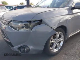 2014 Mitsubishi Outlander SE z VIN JA4AD3A37EZ011335, wystawiony jako IAAI lot #42115343 z przebiegiem 129 159 mil mil oraz . Historia ofert i sprzedaży dostępna na DreamBid. Obrazek 6.