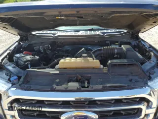 2021 Ford F-150 XL with VIN 1FTFW1E5XMFA47980, listed as a Copart auction lot 56737215 with 63,781 mi miles and Salvage title. Bid and sale history available at DreamBid. Image 11.